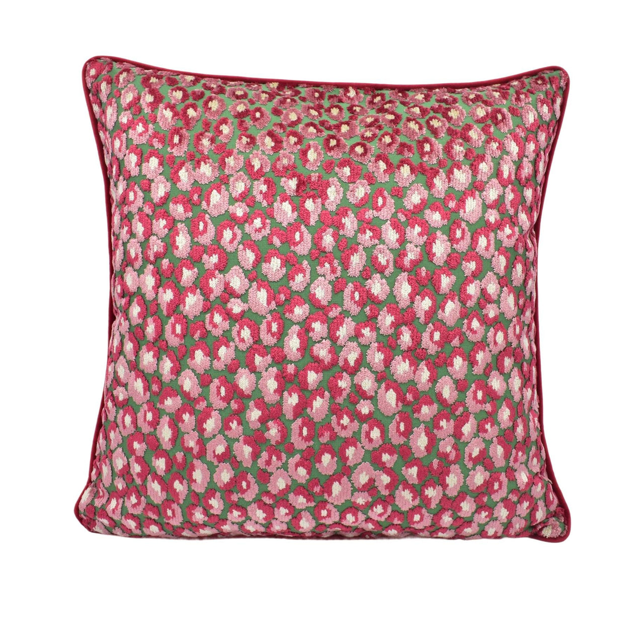 a pink and green floral pillow on a white background