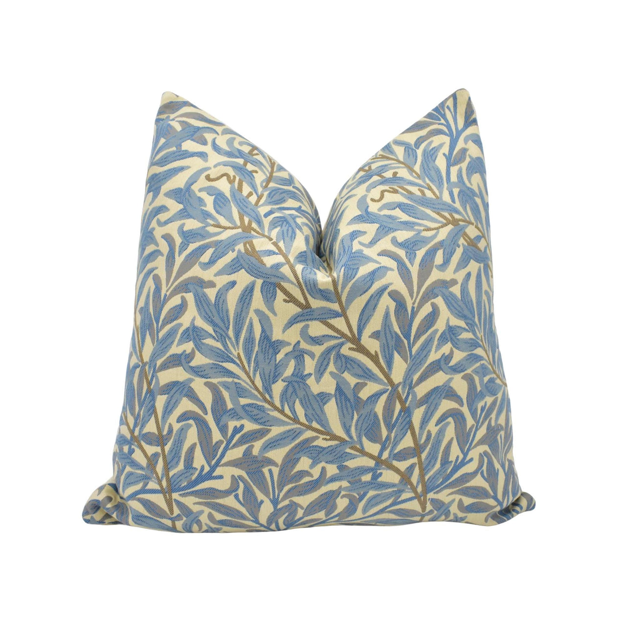 a blue and white pillow with a leaf pattern