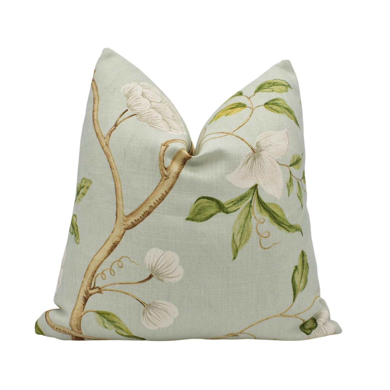 a decorative pillow with a bird on a branch