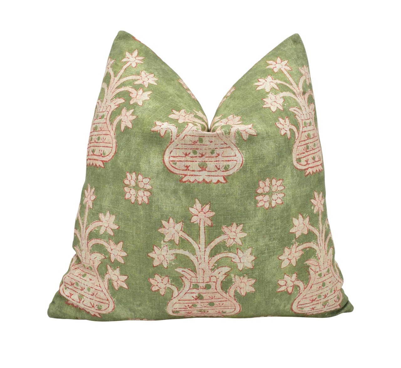 a green and pink pillow with a decorative design