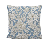 Thumbnail for a blue and white pillow with white flowers on it