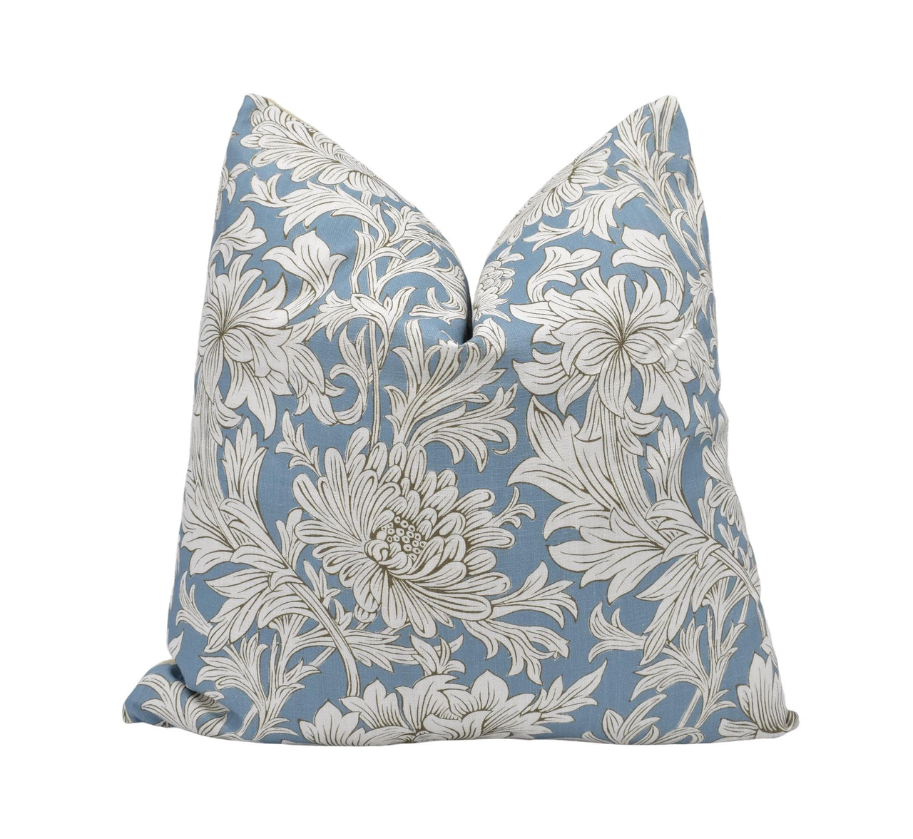 a blue and white pillow with white flowers on it