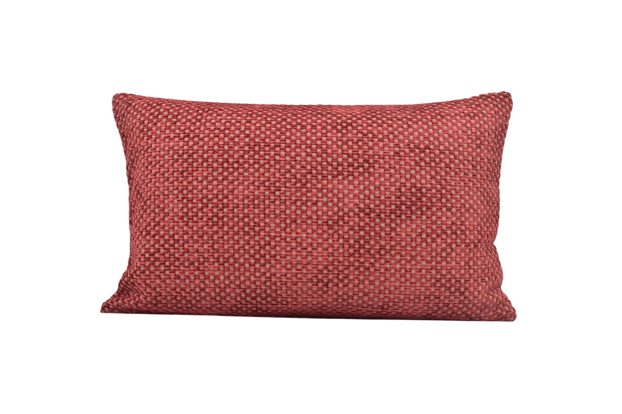 a red pillow on a white background