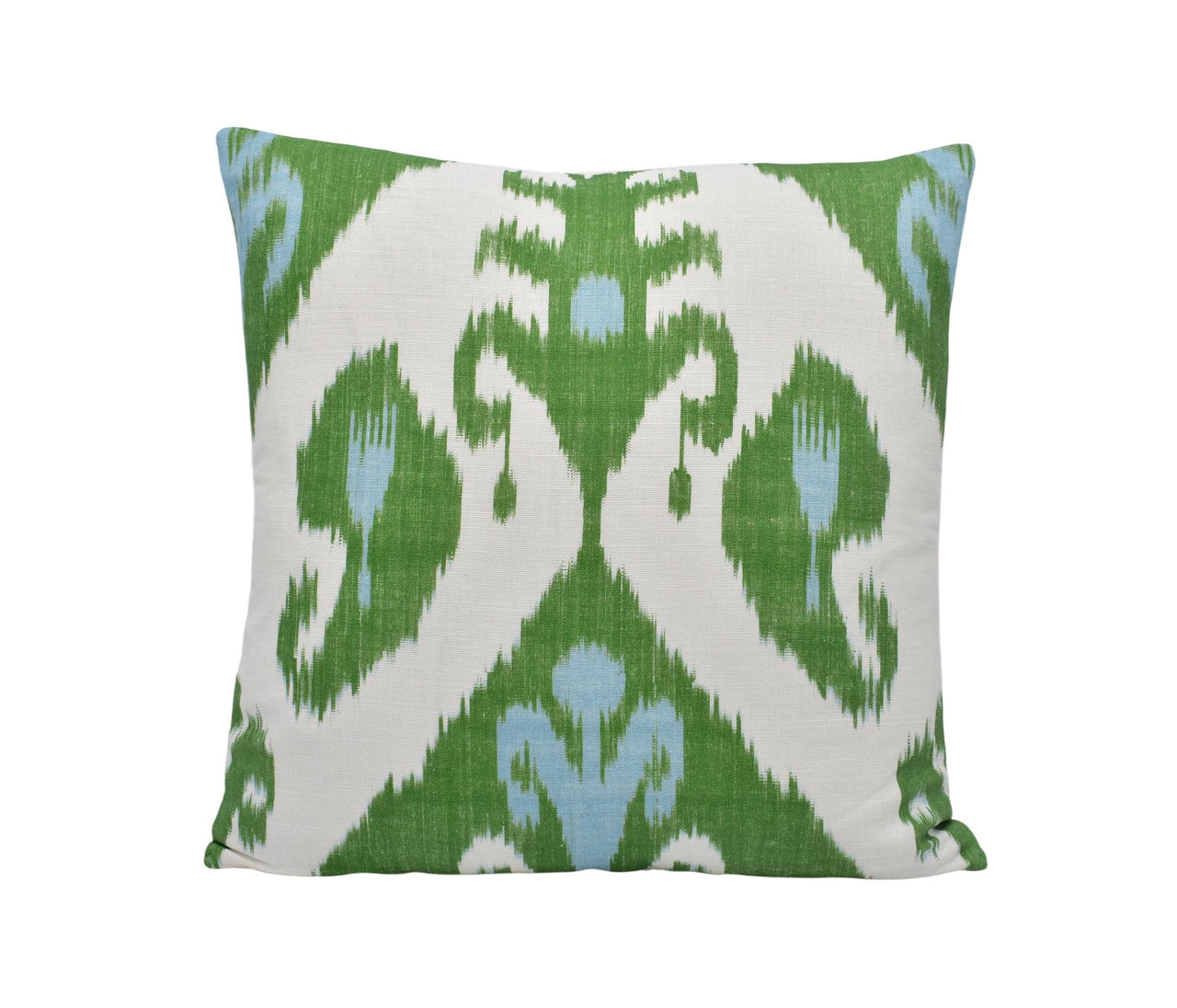 a green and white pillow on a white background