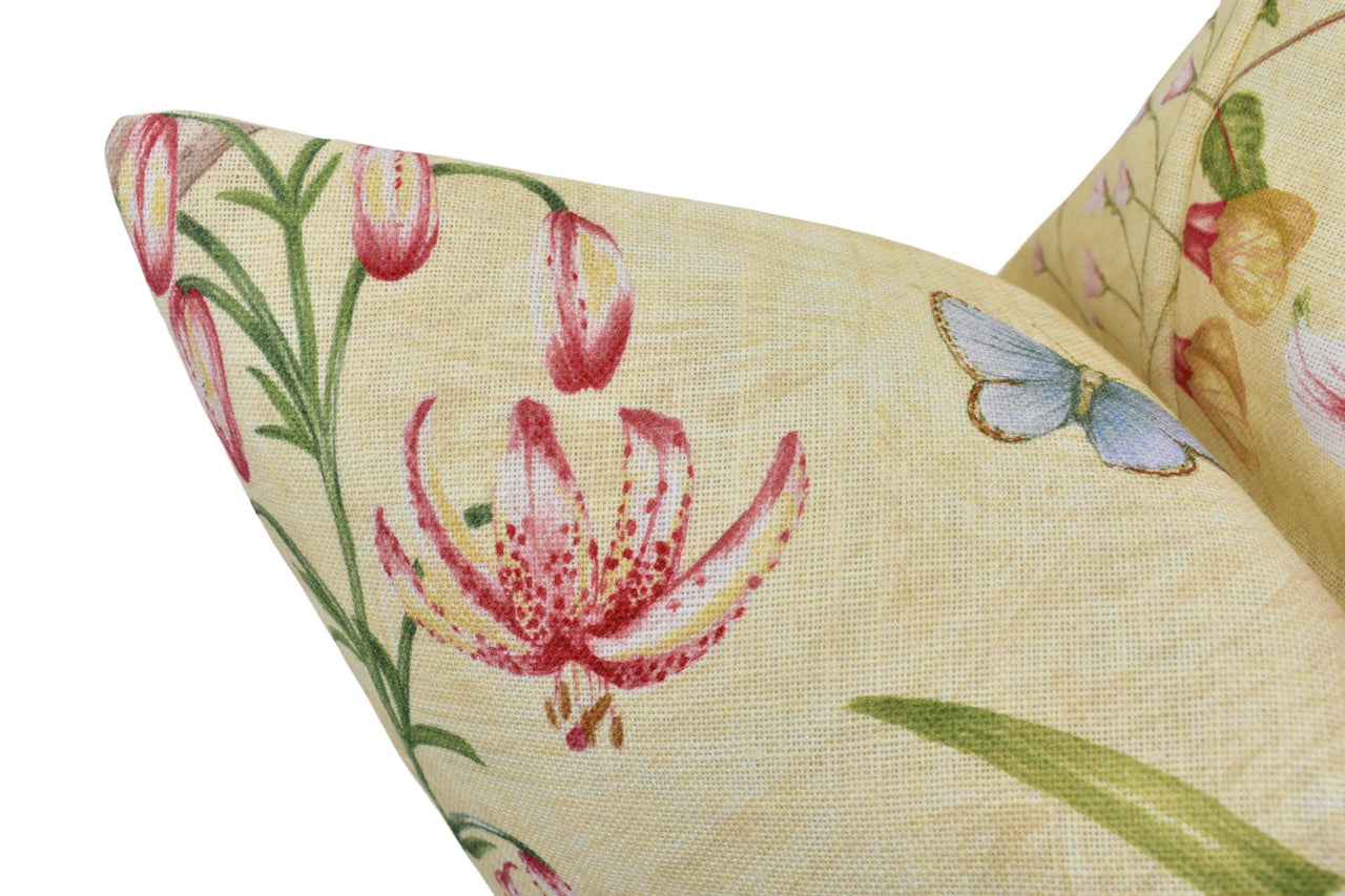 a close up of a pillow with flowers on it